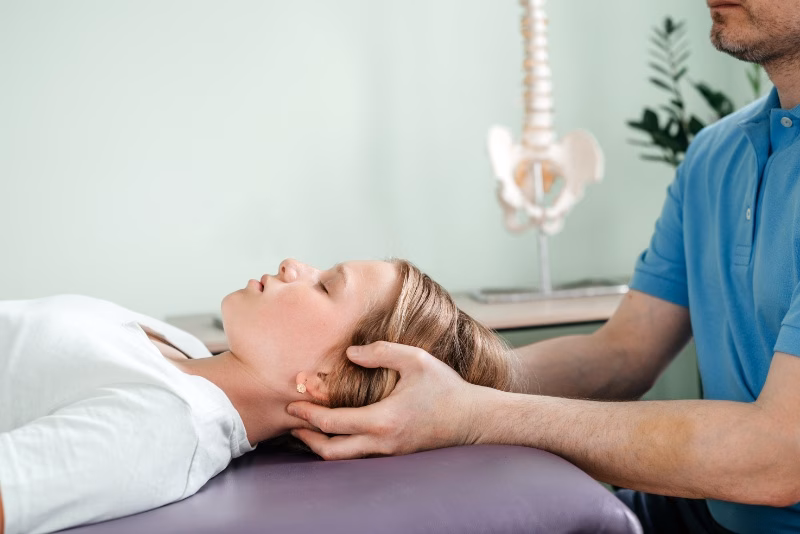 a girl receiving cst treatment by osteopath practi 2024 09 13 05 18 23 utc converted
