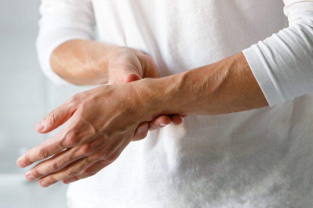 closeup of man arms holding painful wrist caused b 2025 03 08 12 02 55 utc converted