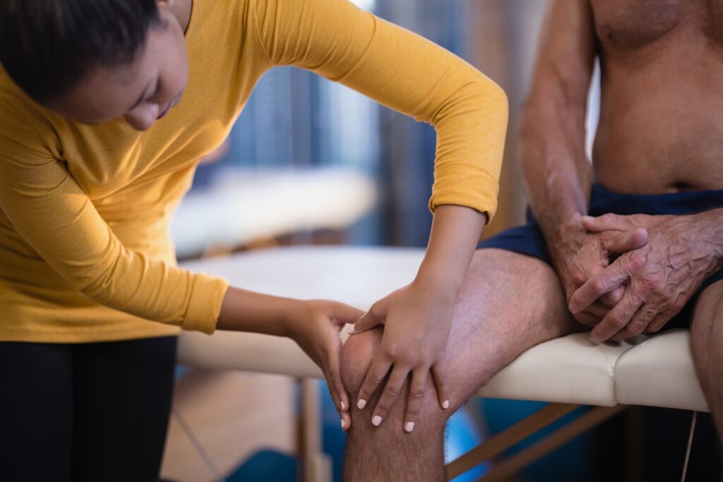 female therapist massaging knee of senior male pat 2025 04 04 05 36 51 utc converted
