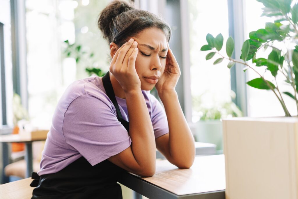 young waitress suffering from headache while worki 2025 02 20 10 21 15 utc converted